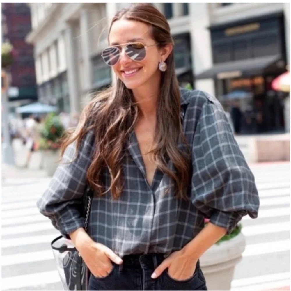 SomethingNavy grey plaid flannel with puff sleeves. Worn once !